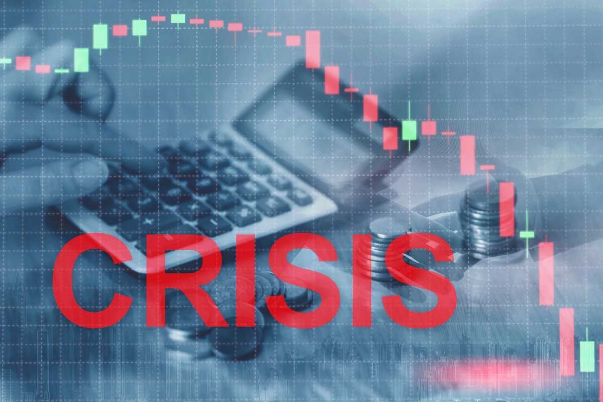 Calculator, falling stock chart, coins, and the word 