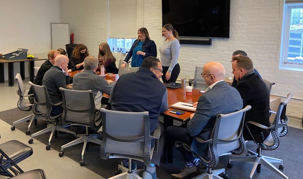 Team playing a facilitated Cards for Culture game