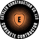 Eutser Construction Co., LLC logo with orange shield and sunburst on black background