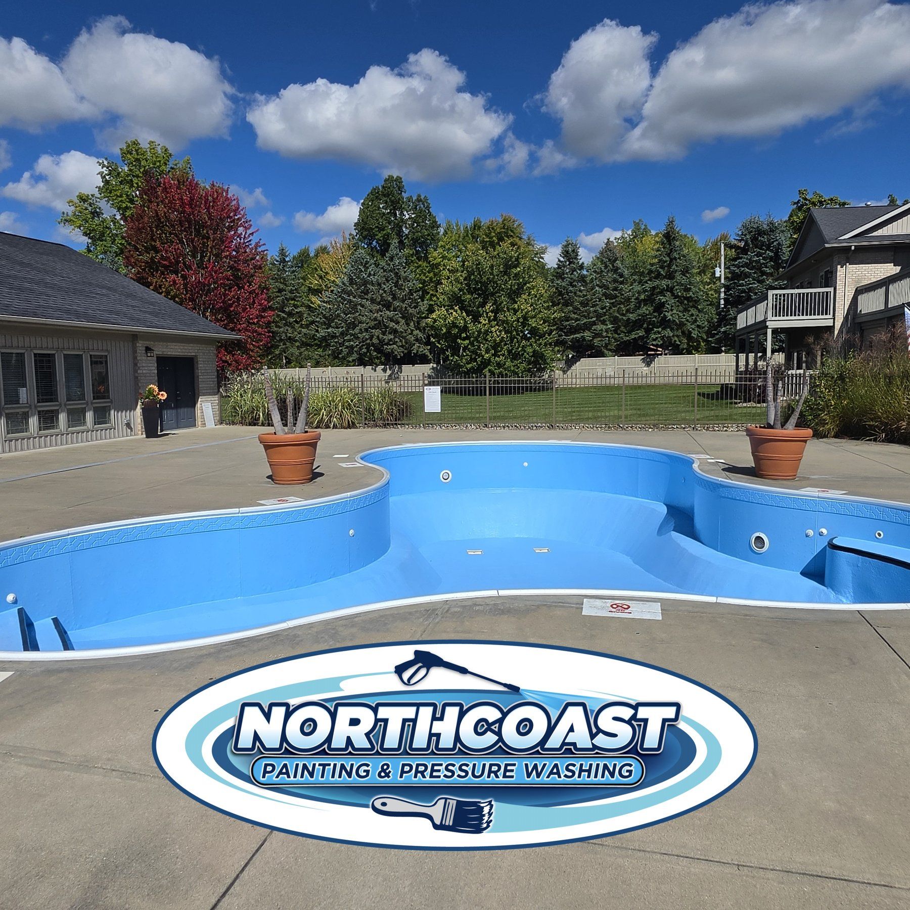 Freshly painted community pool in Mahoning County, Ohio with a clean concrete deck