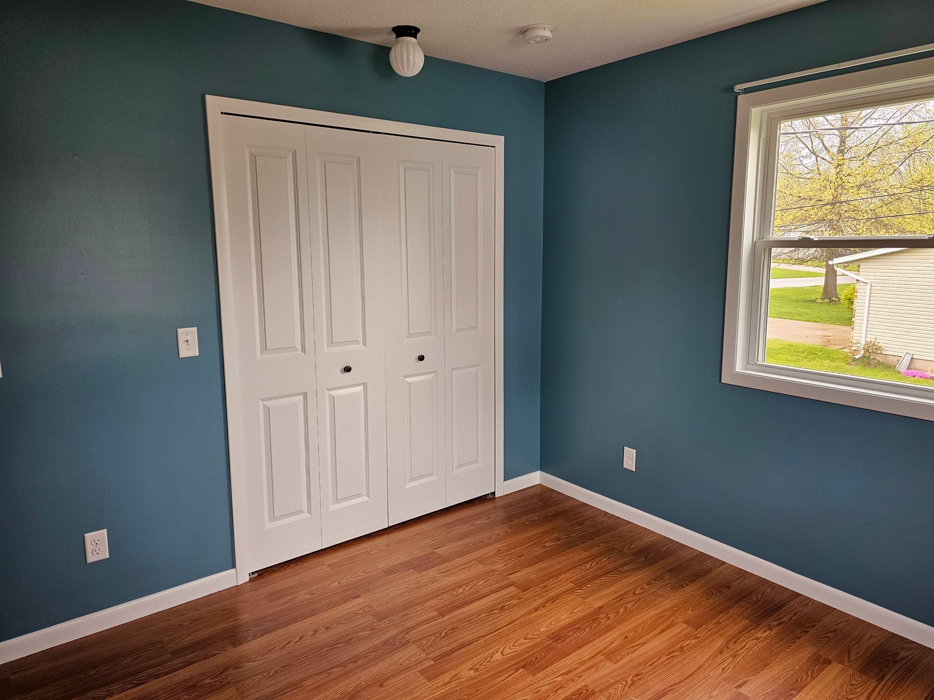 Interior painting project showing room with closet doors in Ohio home
