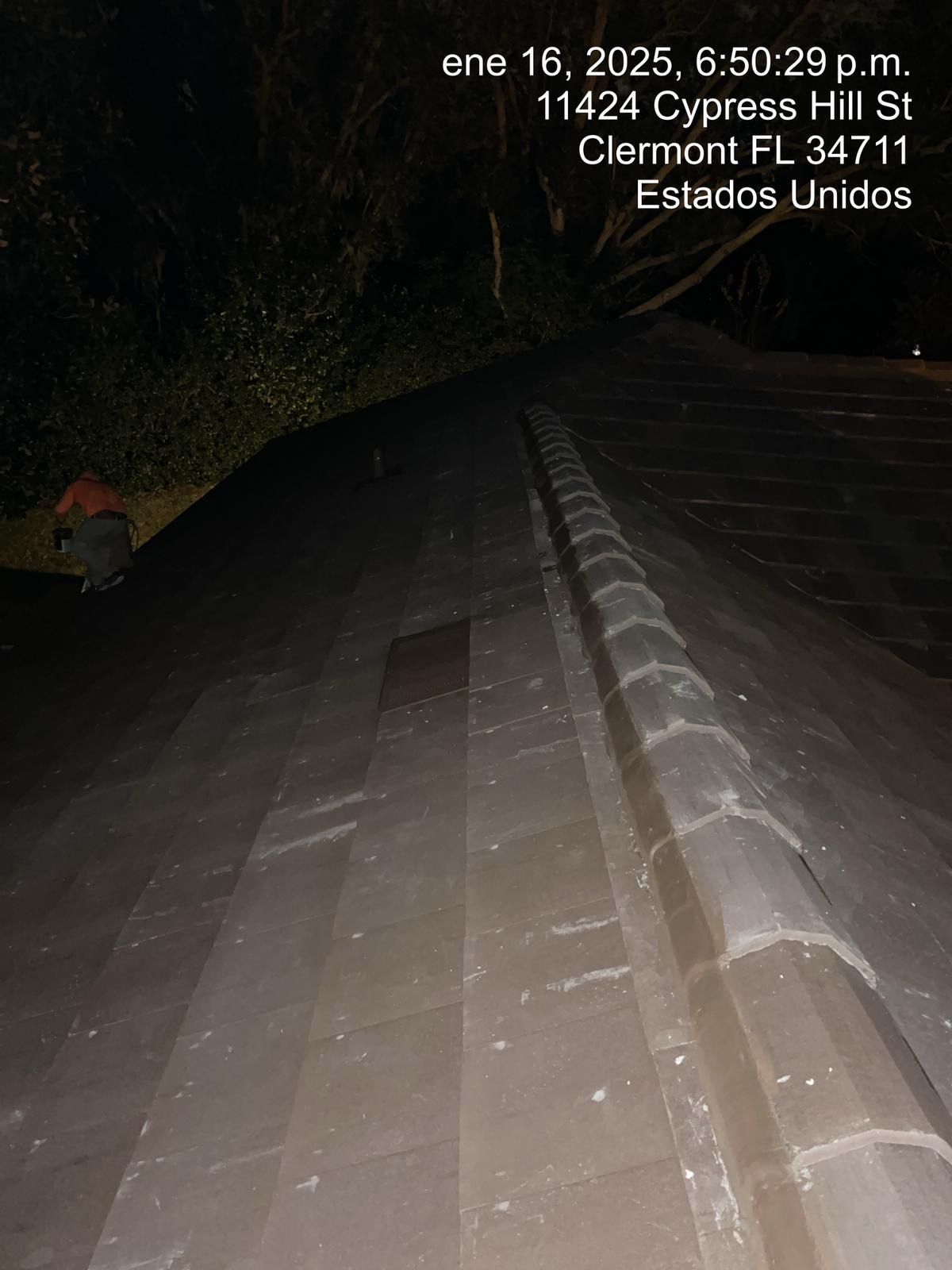 Nighttime road view with a cracked barrier, taken in Cerramento, FL, with date stamp overlay.