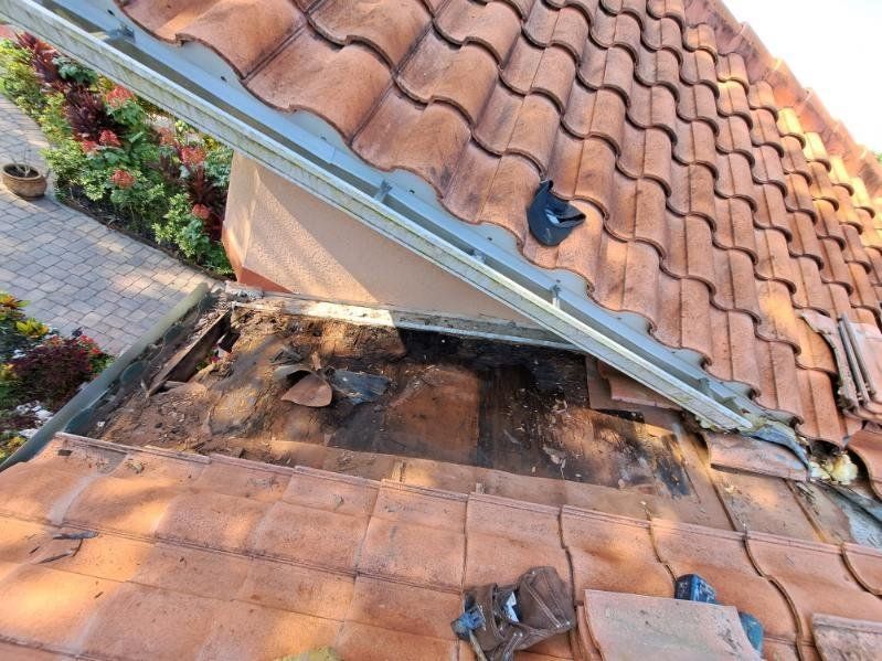 A roof with a hole in it that is being repaired