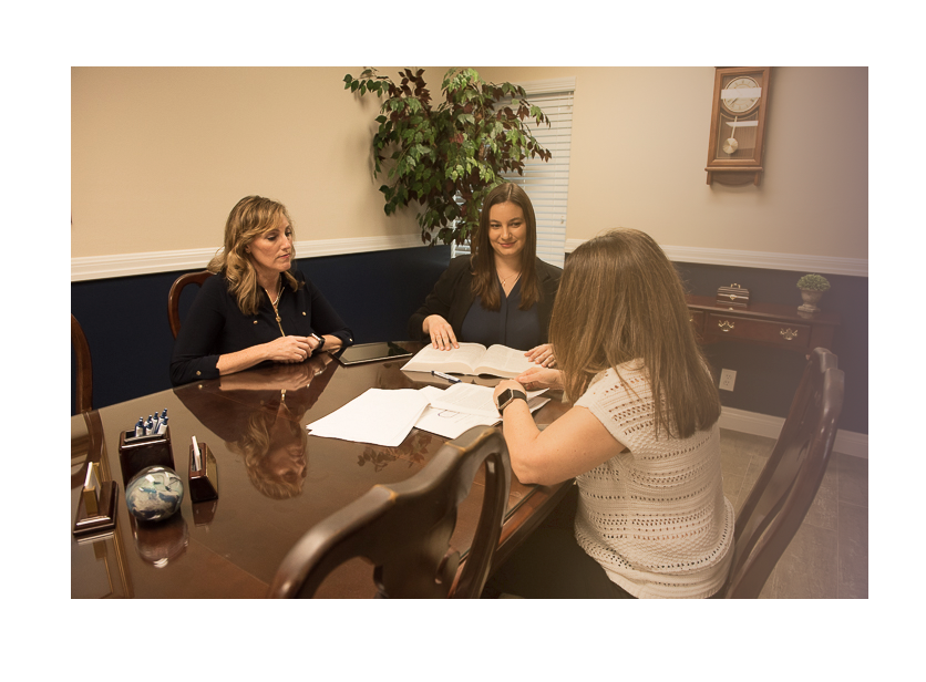 Three Women Working on Papers | Deerfield Beach, FL | Blade Title Company Three Women Working on Papers | Deerfield Beach, FL | Blade Title Company