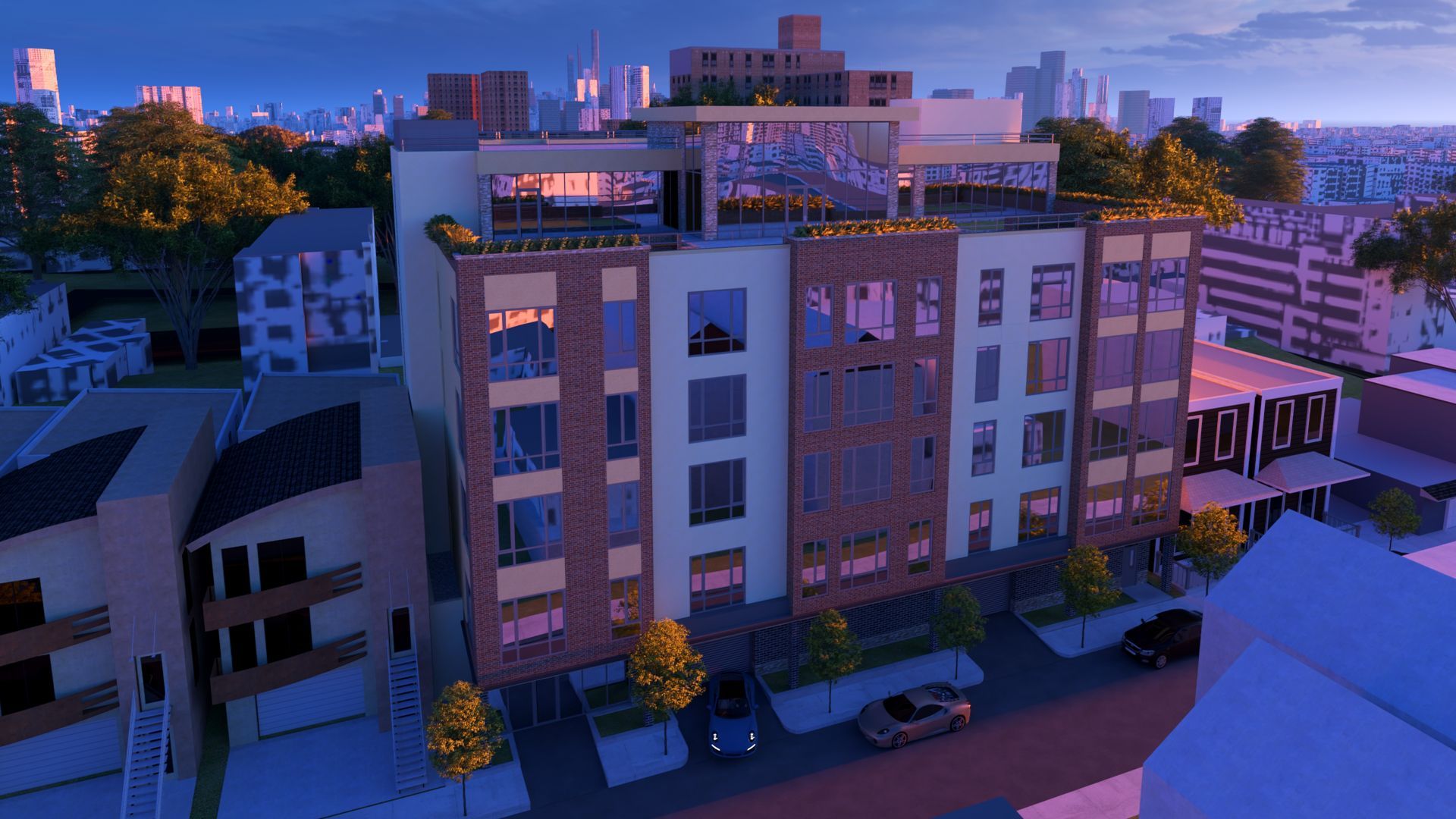 An aerial view of a building in a city at night.