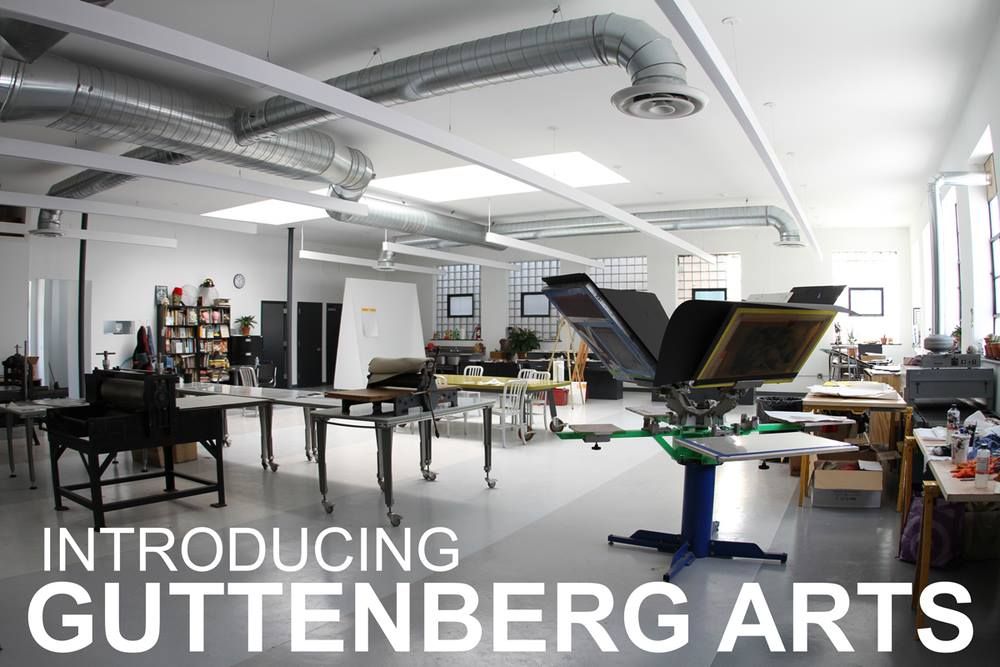A large room with tables and a sign that says introducing guttenberg arts