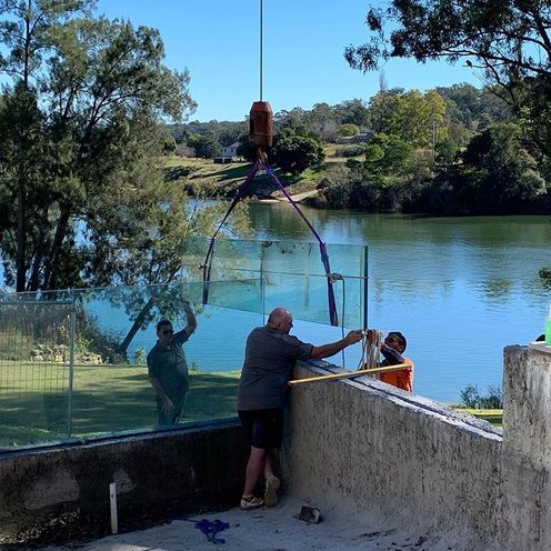Placing Glass Fence — Greater Sydney, NSW — Pacific Pools Pty Ltd