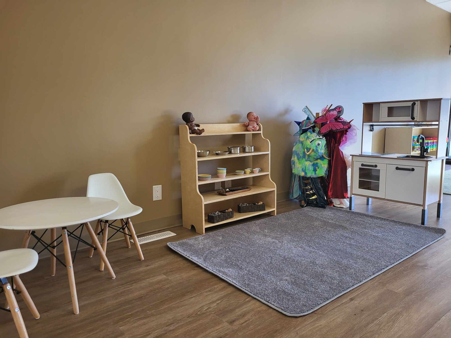 There is a table and chairs in the room.