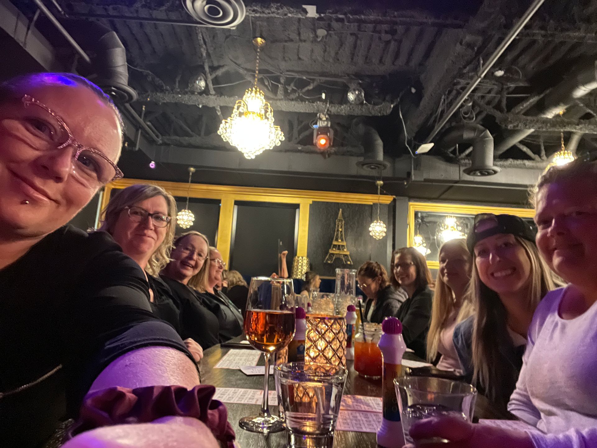 A group of women are sitting at a table in a restaurant.
