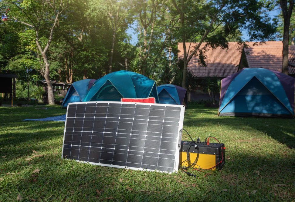 Solar Panel Is Sitting On The Grass — Anthony Cameron Electrical & Solar in Kepnock, QLD