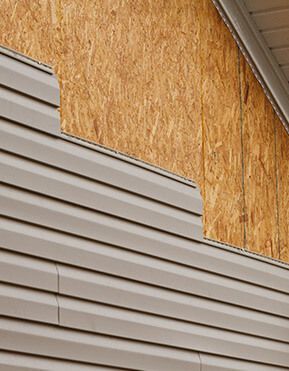 A close up of a house with siding on it.