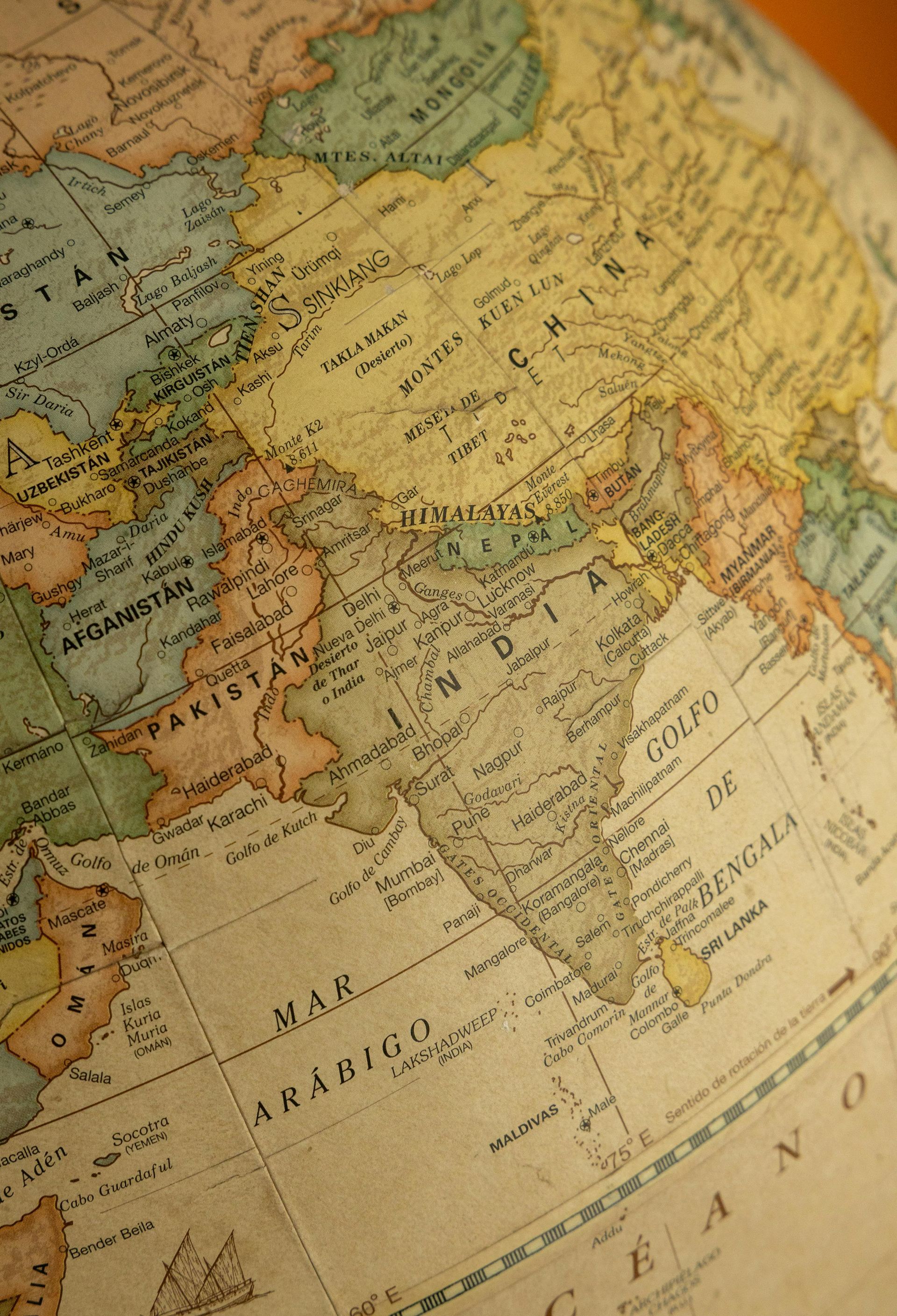 Antique globe with India's outline centered.