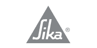 Logo Sika : Texte blanc « Sika » à l’intérieur d’un triangle gris, avec le symbole de marque déposée.
