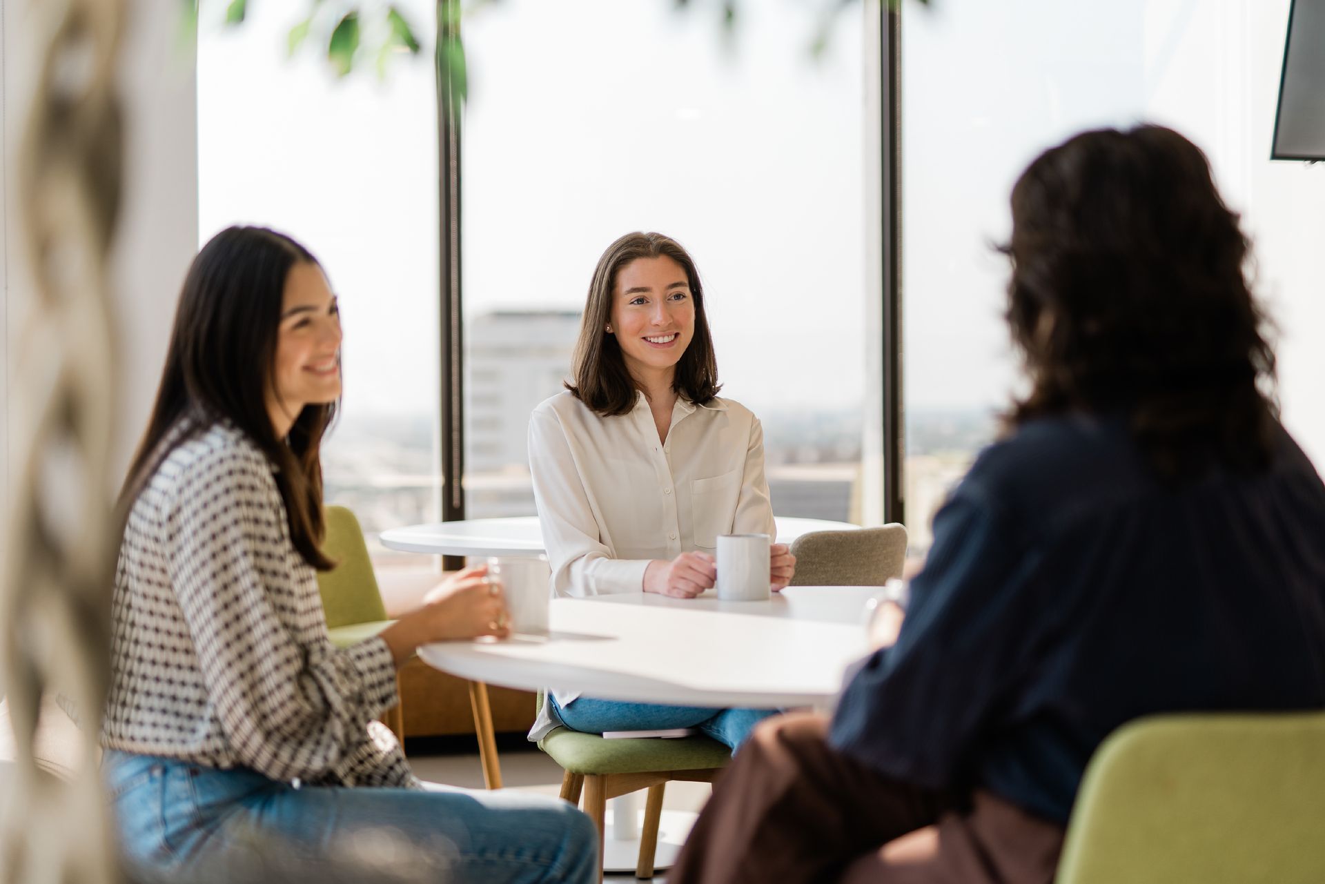 Three women in a coworking space 