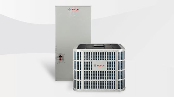 Bosch outdoor AC unit in front of a tall gray cabinet, on a white background