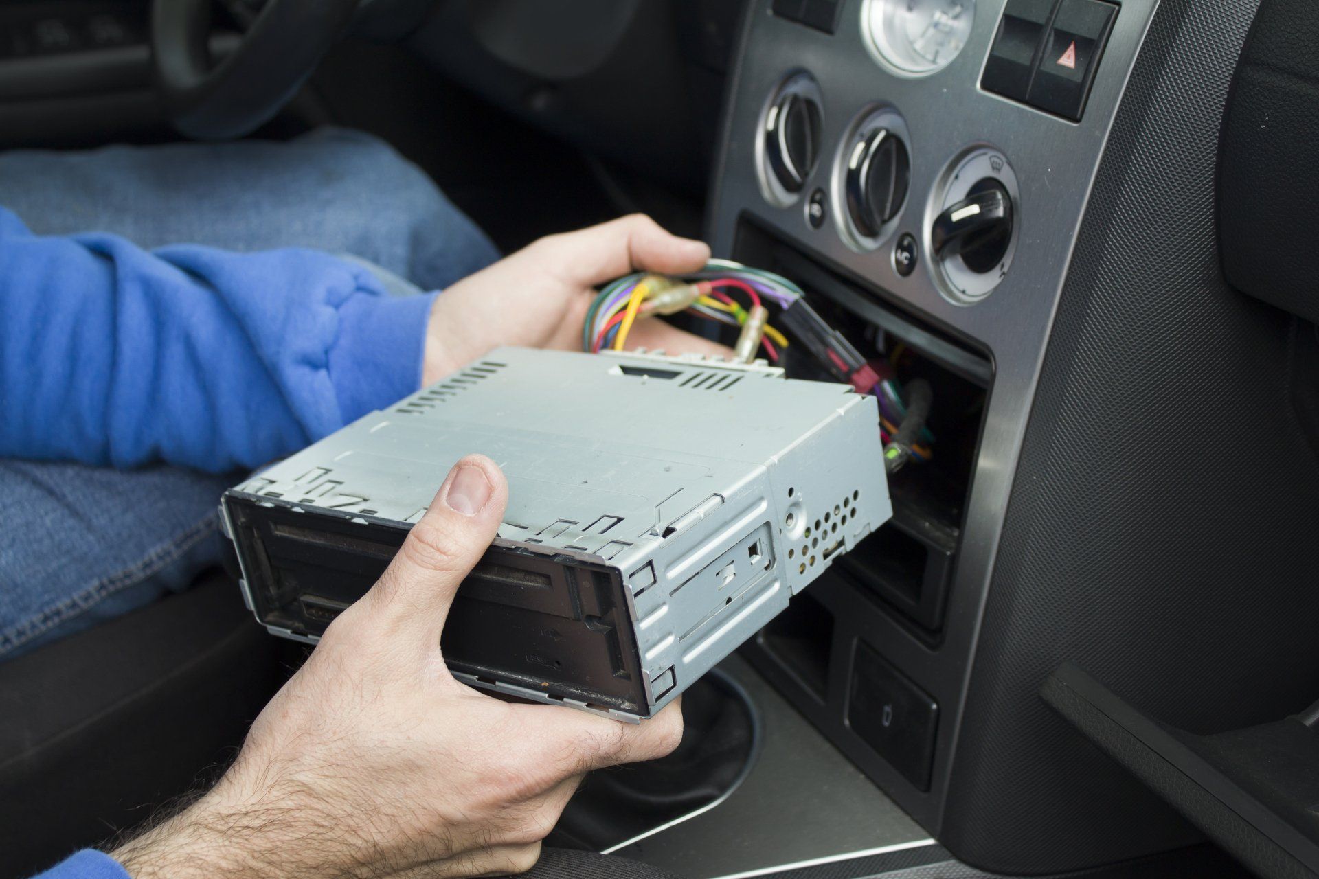 Mechanic Puts A Car Radio Into A Car Radio Pocket — McKinney, TX — Auto Eclipse