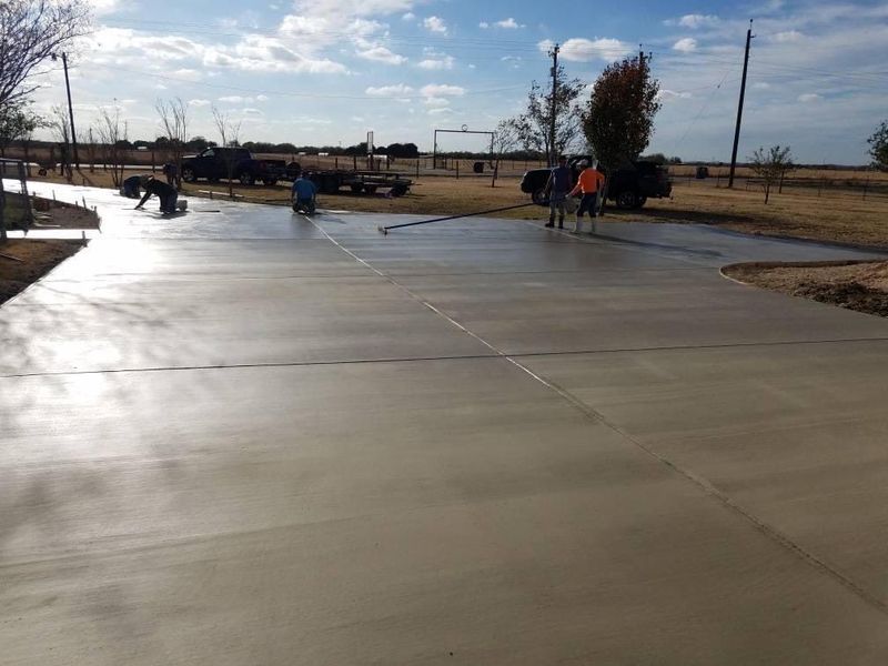 Crew finishing a large concrete pour