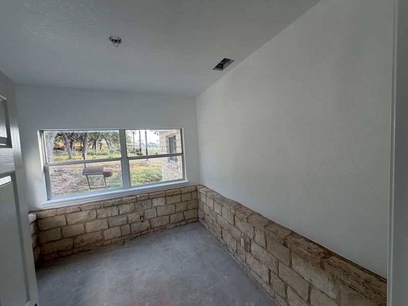 Room addition with a limestone wall interior