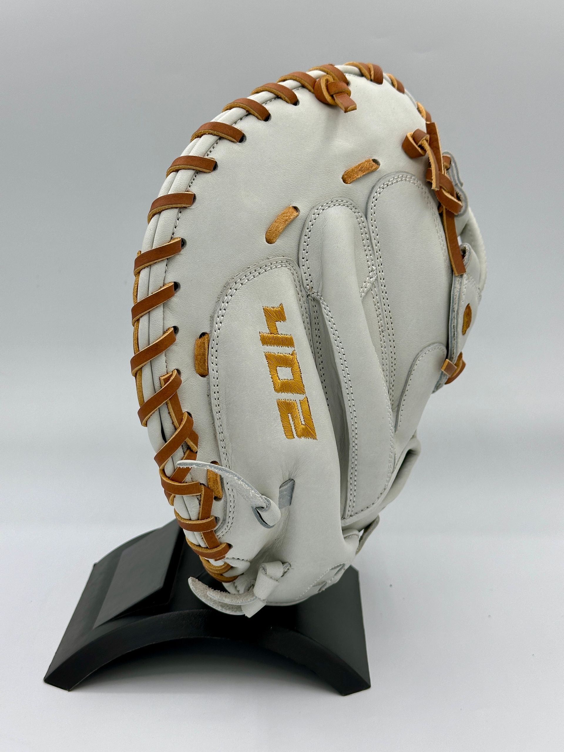 A white baseball glove with the word hope on it