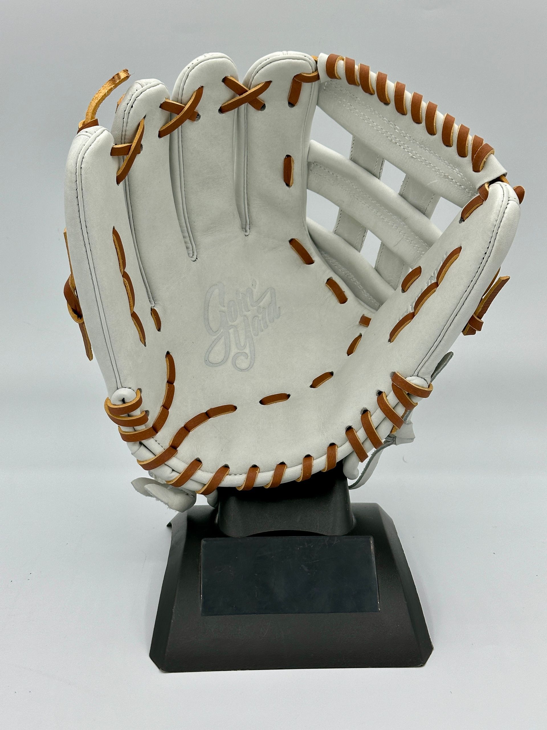 A white baseball glove with the number 28 on it