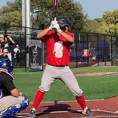 A baseball player is getting ready to bat on a baseball field.