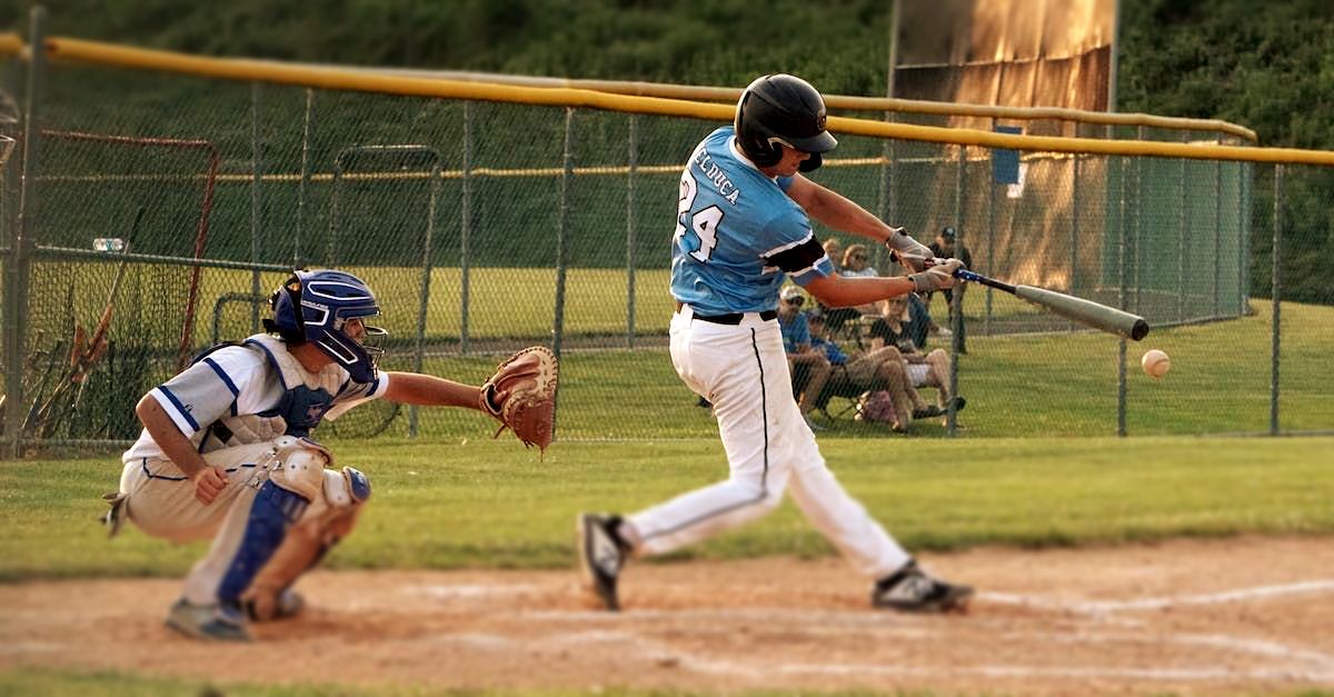 A baseball player with the number 3 on the back of his jersey