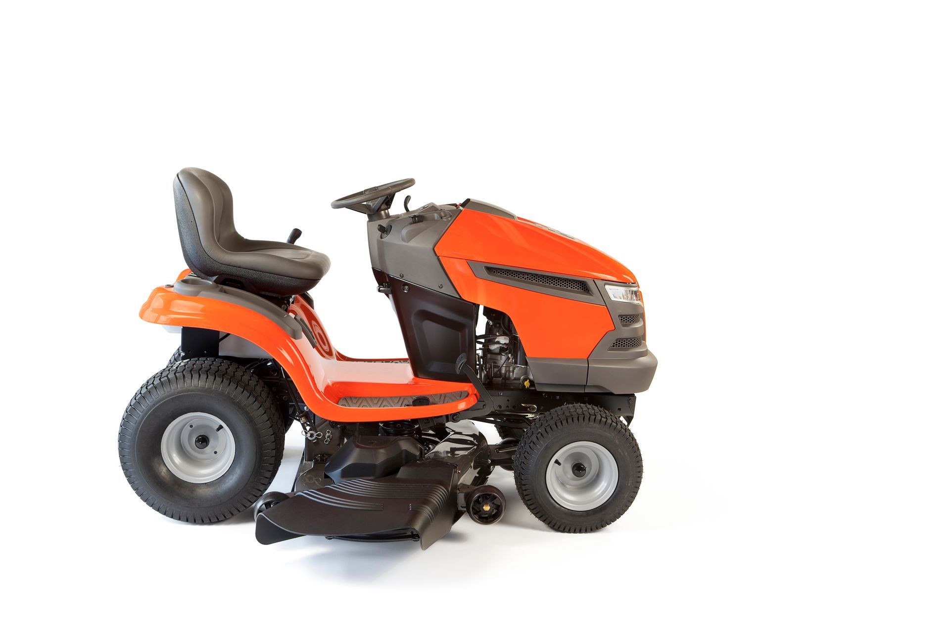 A lawn mower is sitting on a white surface.