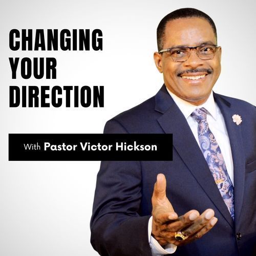 Pastor Victor Hickson smiling, gesturing with his hand, next to the text 
