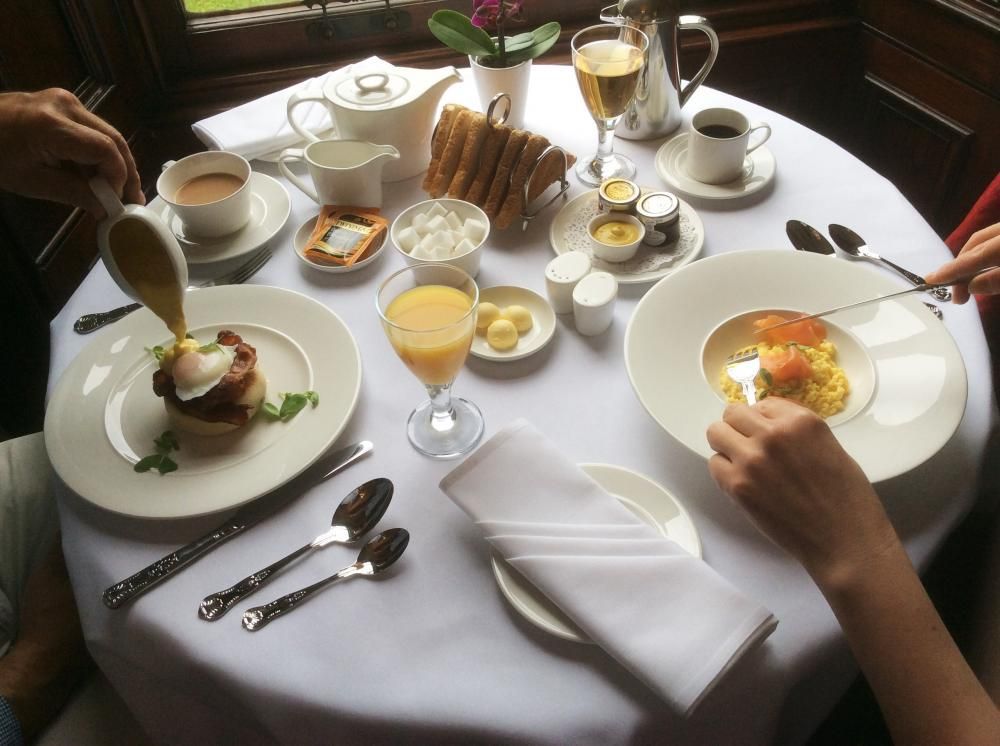 Breakfast table with coffee, pastries, eggs, and juice. the breakfast room pitlochry scotland. an ideal base to explore whisky distilleries