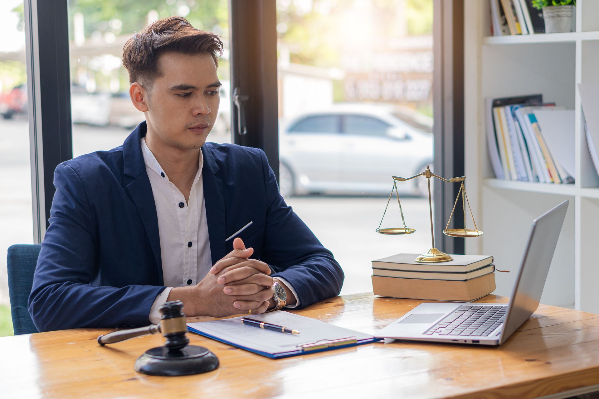 Estate and trust administration attorney reviewing trust documents at a desk
