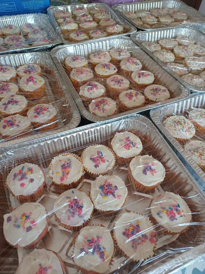 a bunch of cupcakes with frosting and sprinkles on them