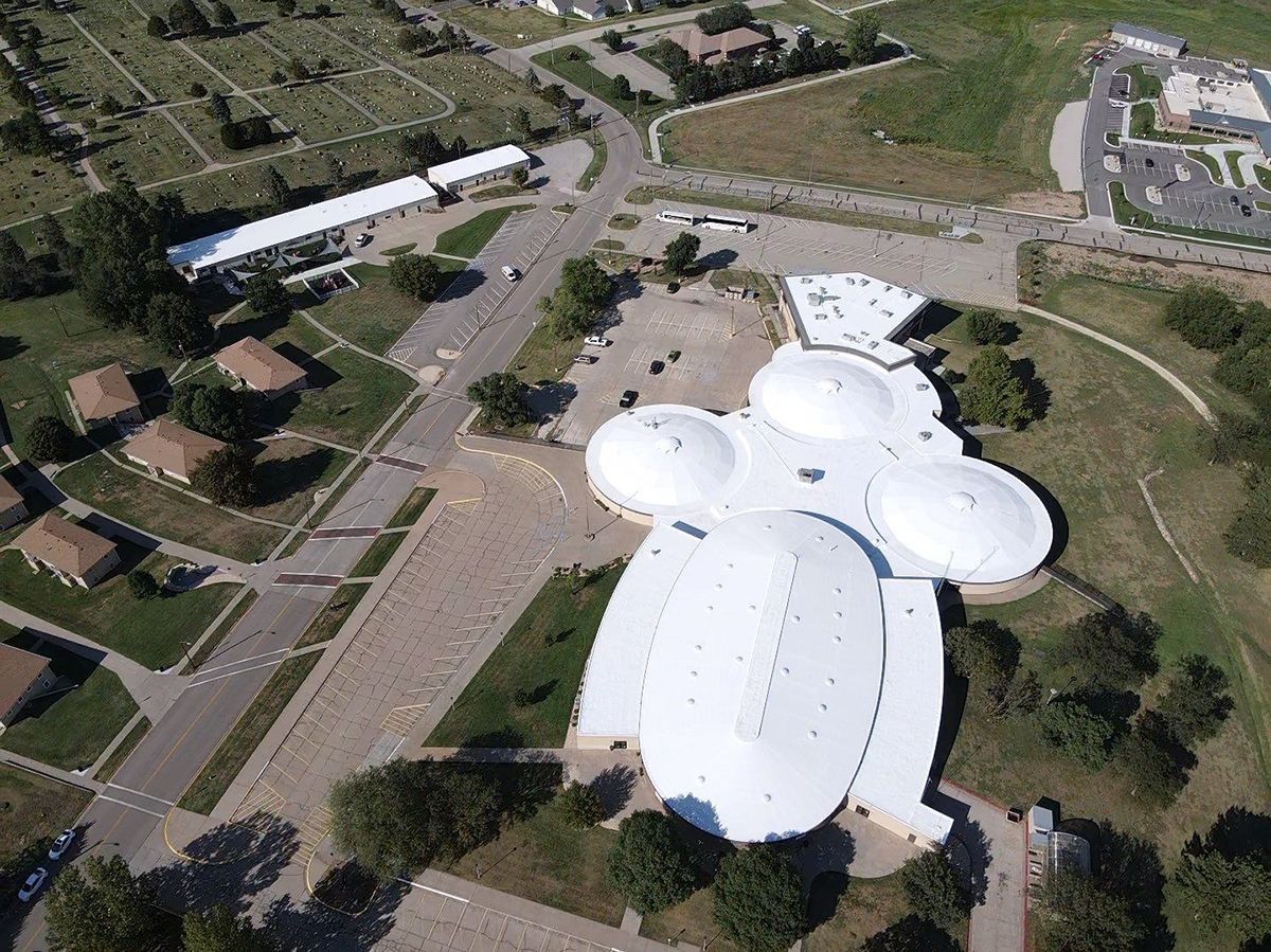 Aerial view of the Omaha Children's Museum with its distinctive white dome-shaped roofs.