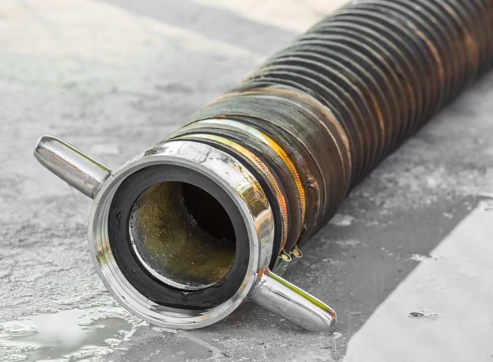 Close-up of a Black, Corrugated Hose With a Silver Connector — Coastcut Concrete Cutting Pty Ltd in Newcastle, NSW
