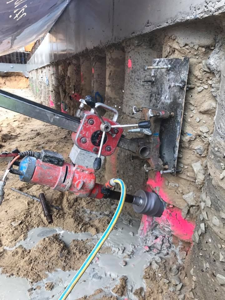 A Concrete Coring Machine Drilling Into a Wall — Coastcut Concrete Cutting Pty Ltd in Corlette, NSW