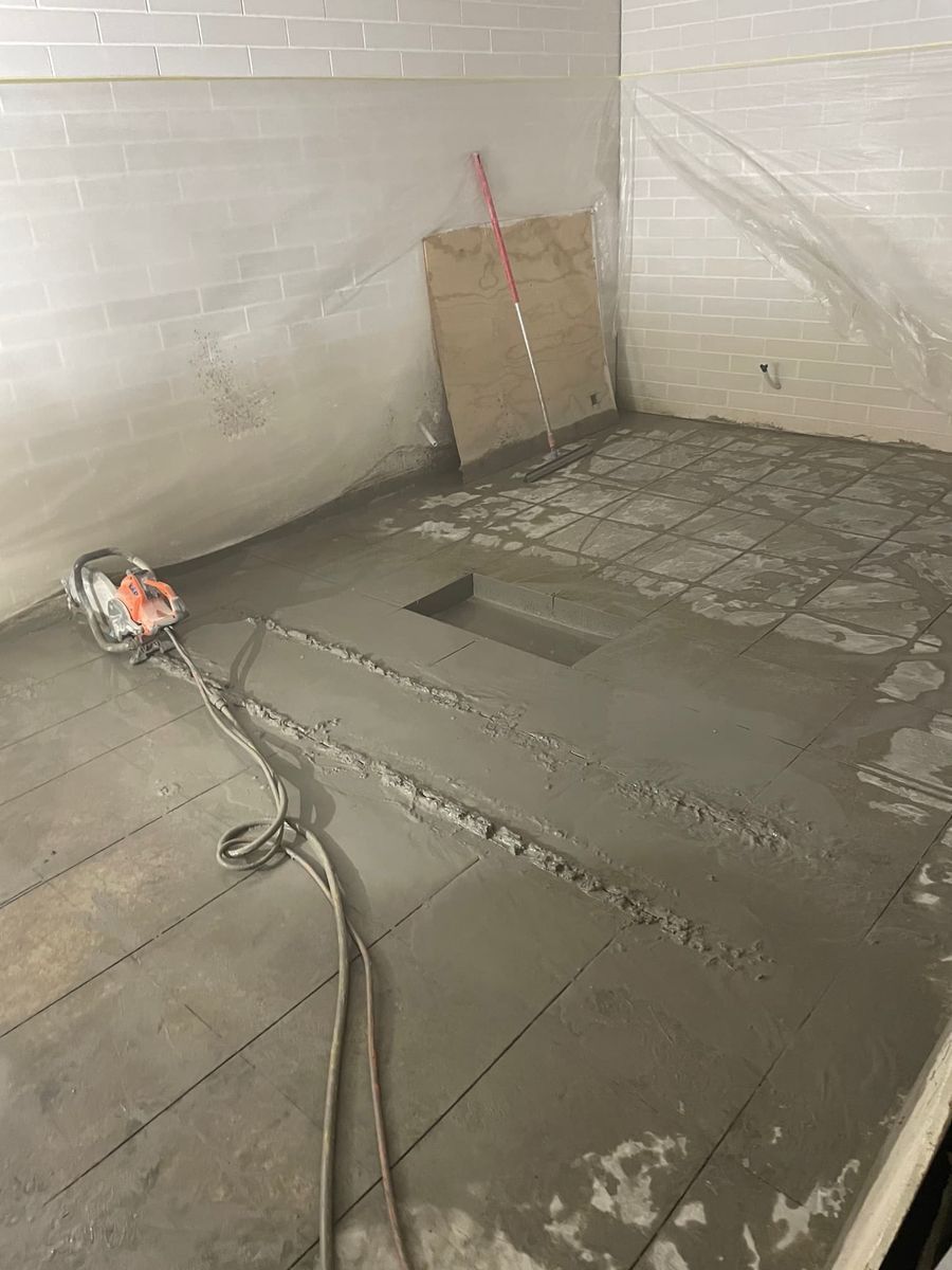 Concrete Floor Work in Progress: a Saw, Wet Concrete — Coastcut Concrete Cutting Pty Ltd in Corlette, NSW