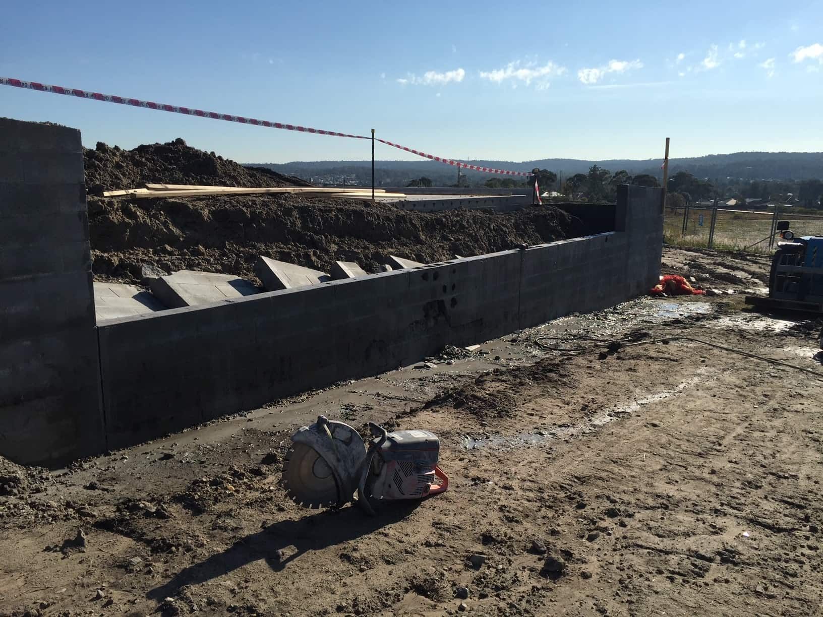 Concrete Retaining Wall Under Construction — Coastcut Concrete Cutting Pty Ltd in Corlette, NSW