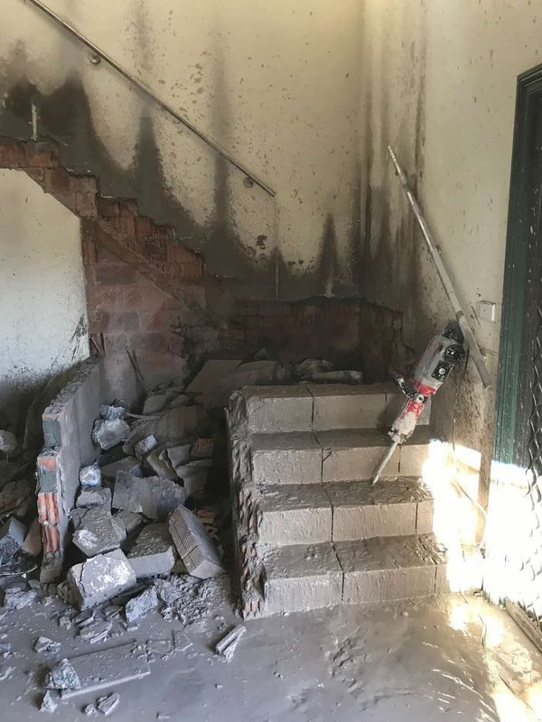 Demolished Concrete Staircase With Scattered Debris — Coastcut Concrete Cutting Pty Ltd in Newcastle, NSW