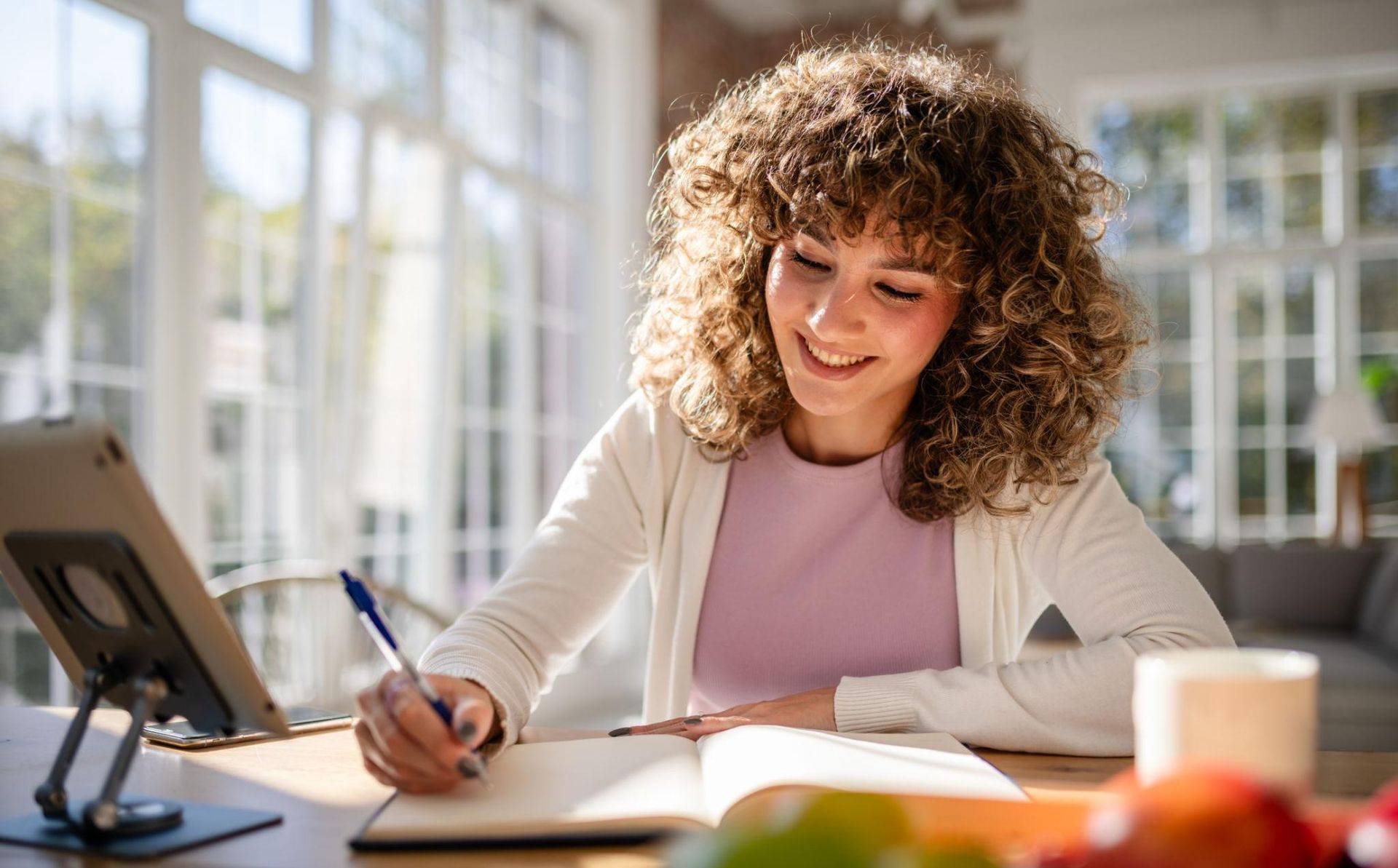 Individual journaling during a quiet moment of self-reflection focused on personal growth.
