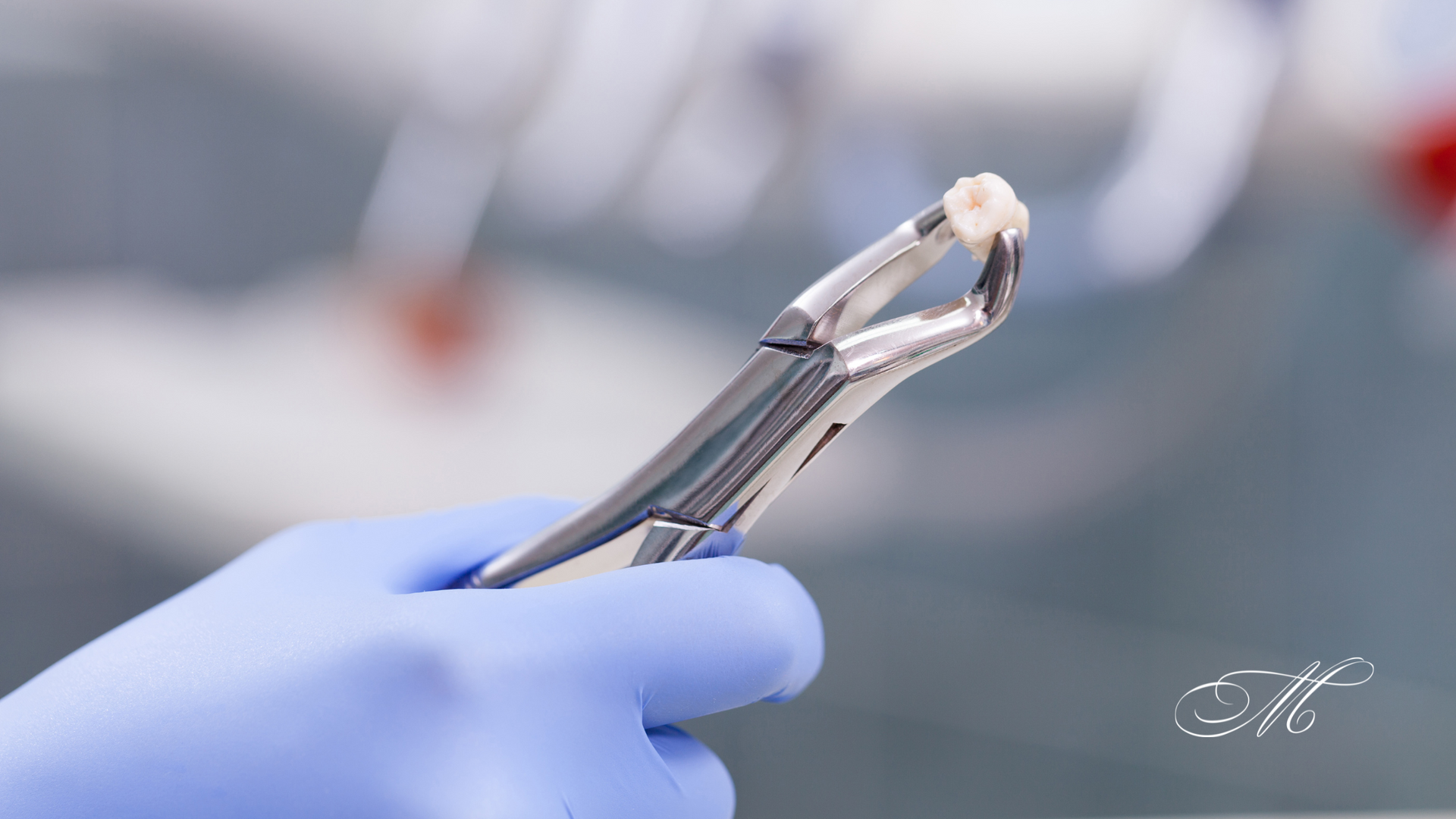 A person wearing blue gloves is holding a pair of dental pliers.