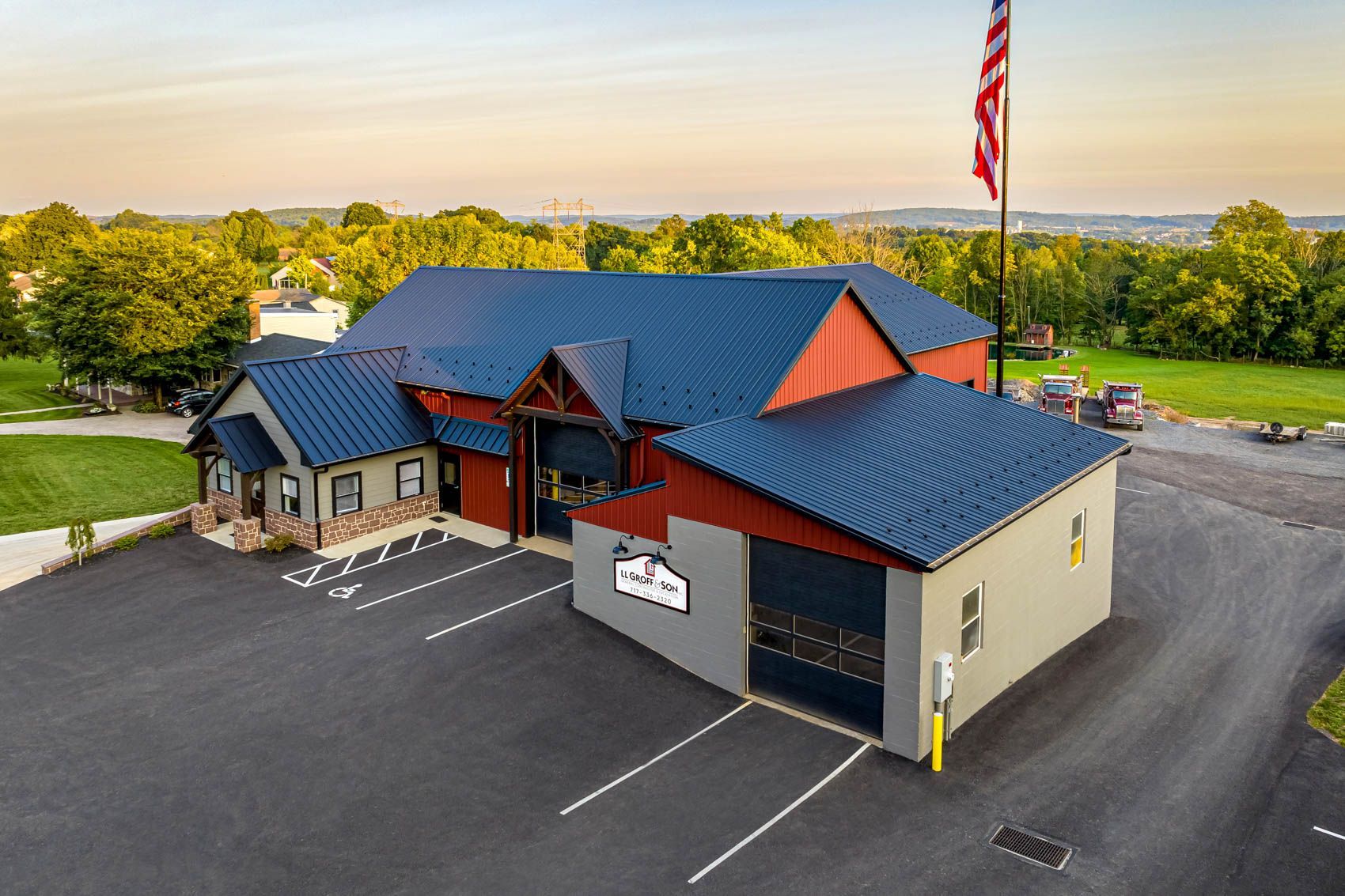A building with a blue roof, red walls, and an American flag.