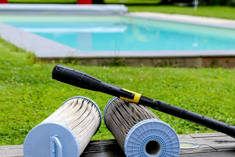 Pool filter cartridges showing dirty and clean comparison at a Baton Rouge, Louisiana pool.
