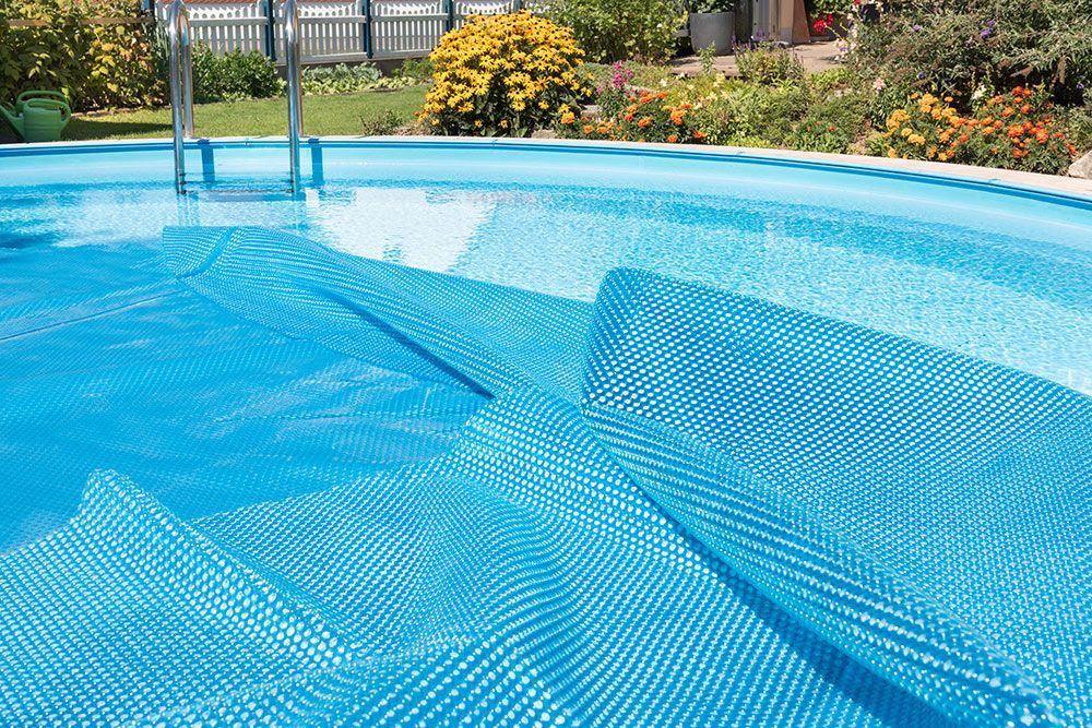 Covered swimming pool prepared for seasonal opening or closing in Baton Rouge, Louisiana.