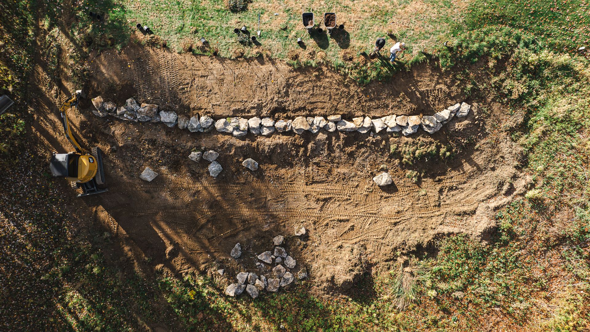 An aerial view of a group of people standing in a field.