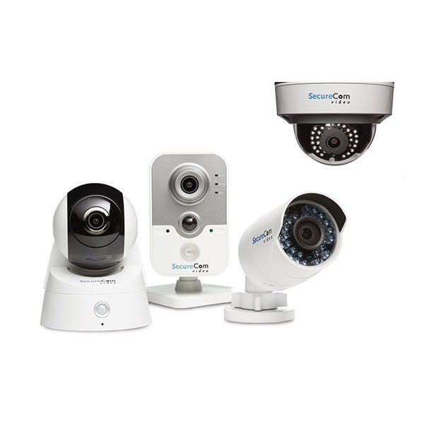 A group of security cameras are sitting next to each other on a white background.