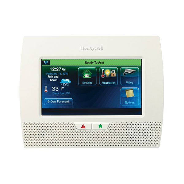 A thermostat with a screen that says ready to arm