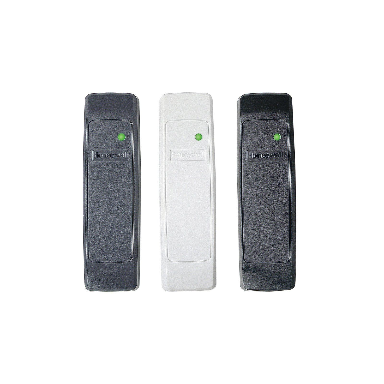 Three different colored remote controls are sitting next to each other on a white background.