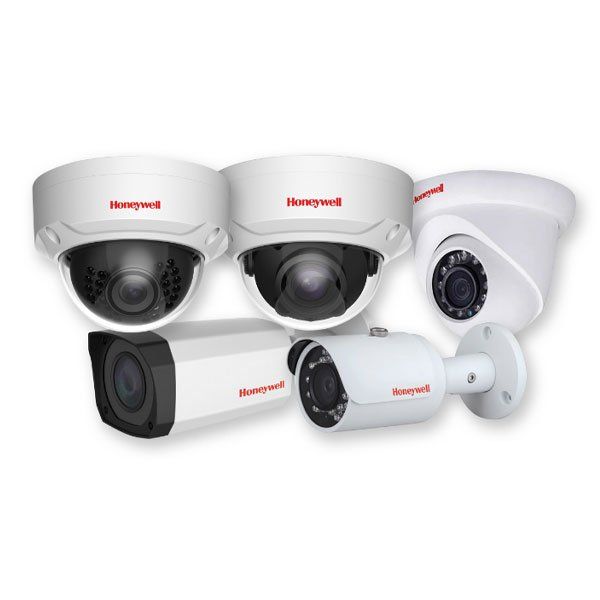 A group of honeywell security cameras on a white background