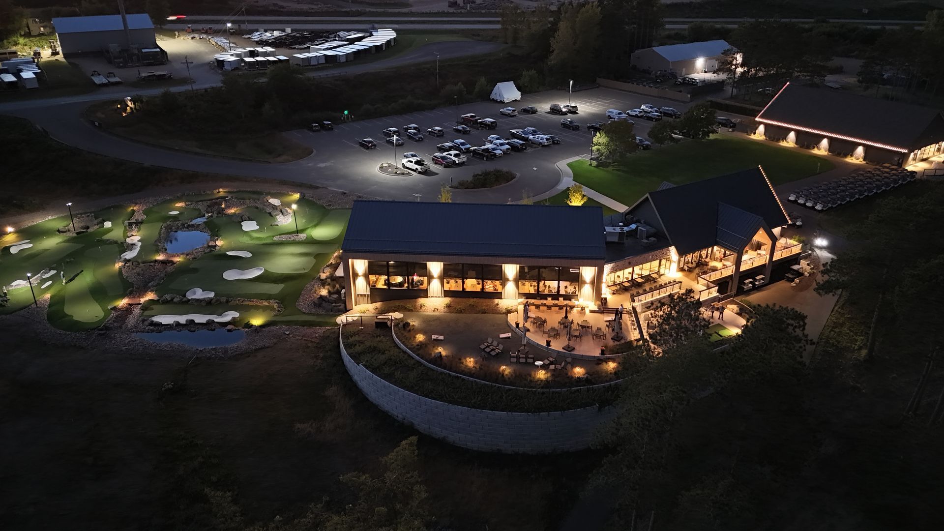 drone shot of the etablishment lit up at night