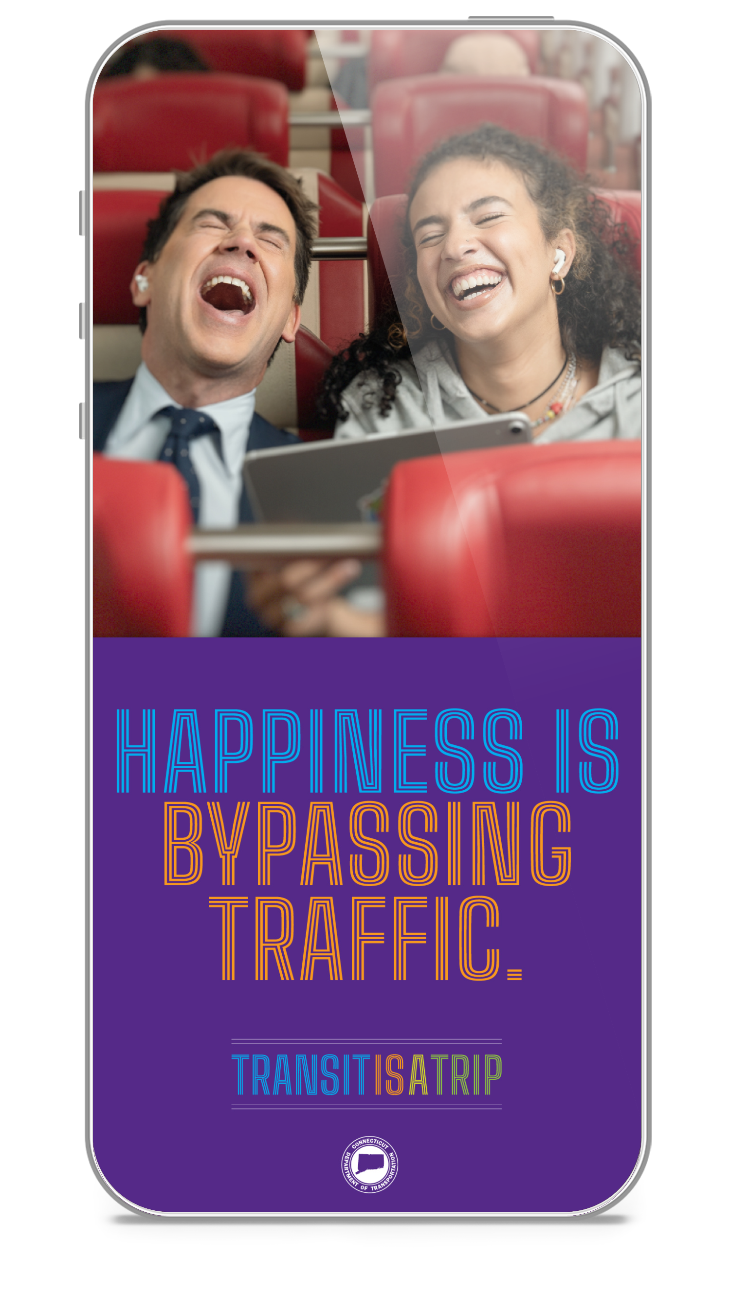A man and a woman are laughing on a bus with a headline