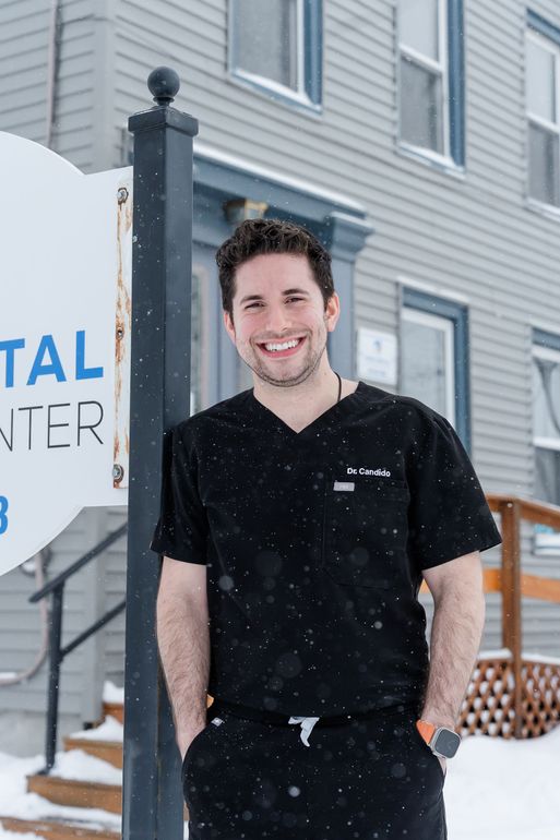 Dr. Candido outside Rome Dental on West Thomas Street in the snow